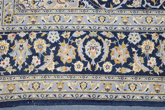 A Tabriz style blue ground carpet 388 x 279cm